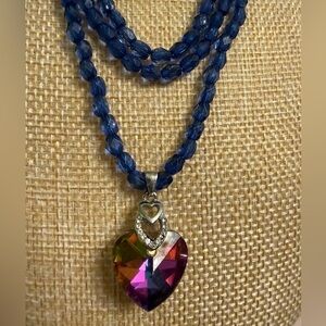 Beautiful necklace with iridescent rainbow heart pendant and sparkly blue beads